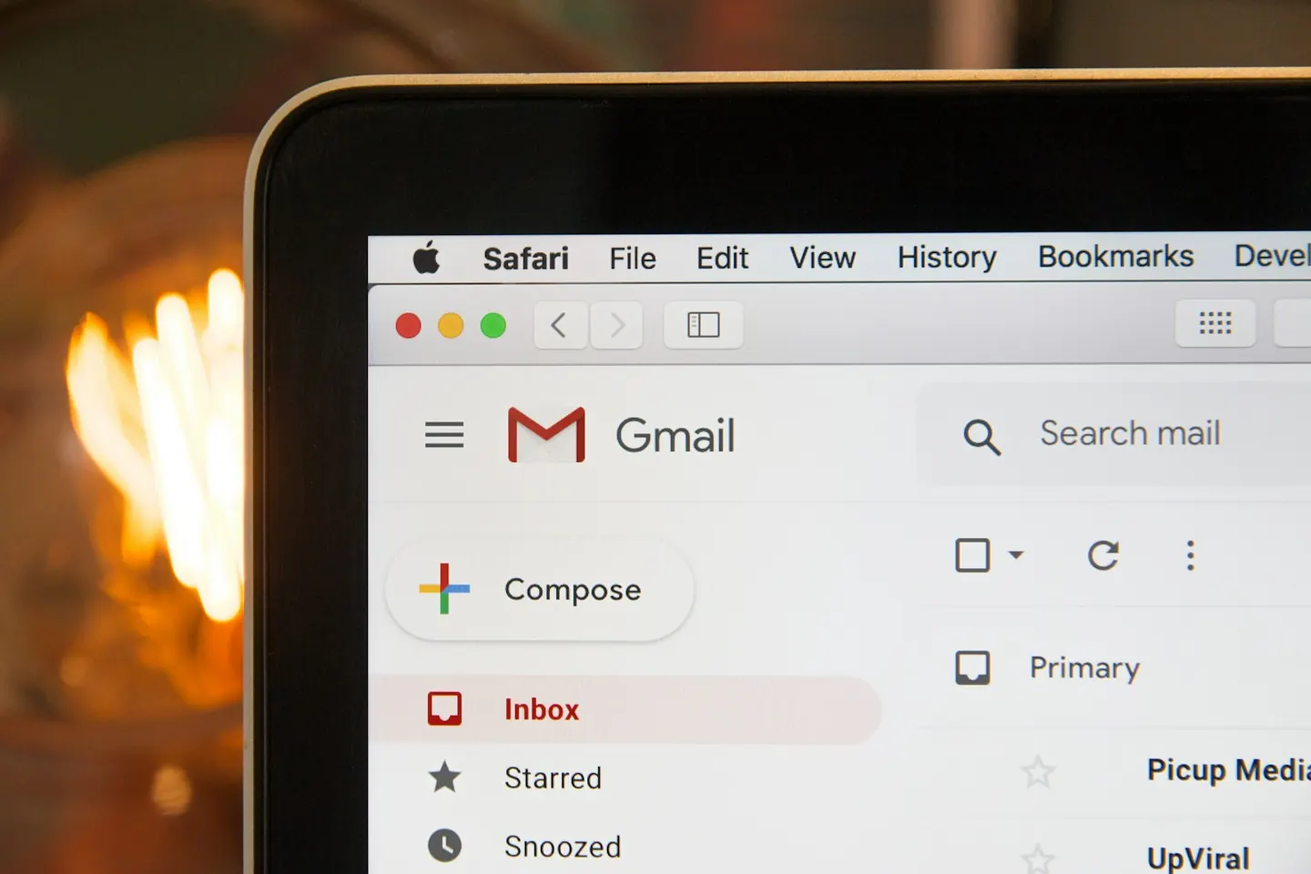 Gmail open on a laptop, with the Compose button in view